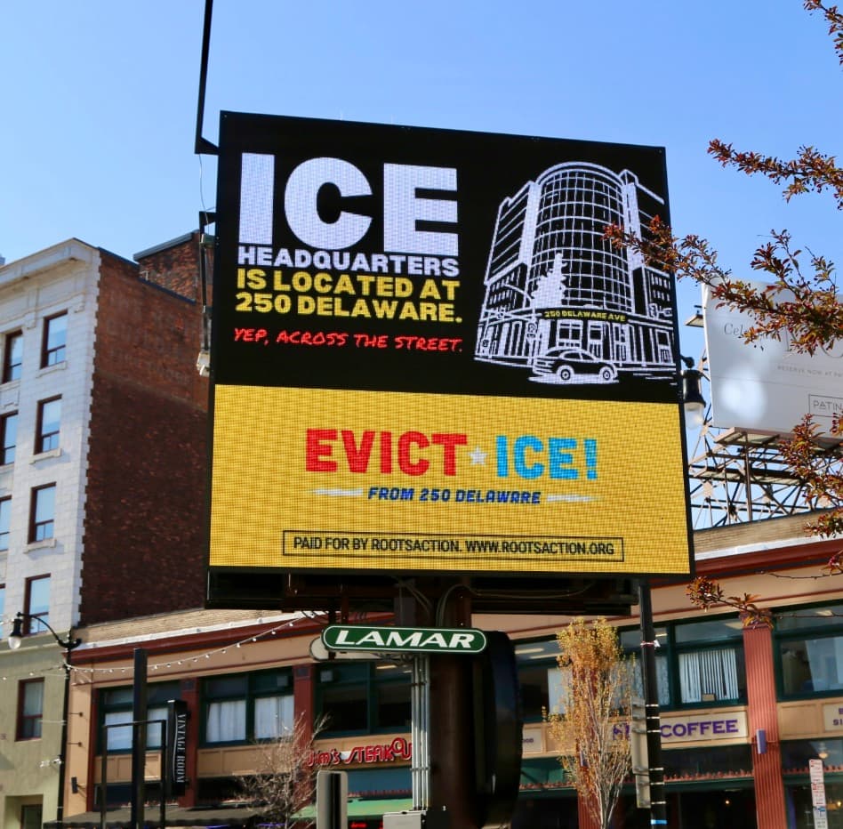 Billboard reading 'ICE headquarters is located at 250 Delaware'